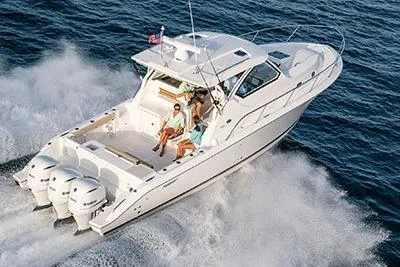 Slide: The Image of 2026 Pursuit OS 355 Offshore boat cruising on open water with passengers. - 3