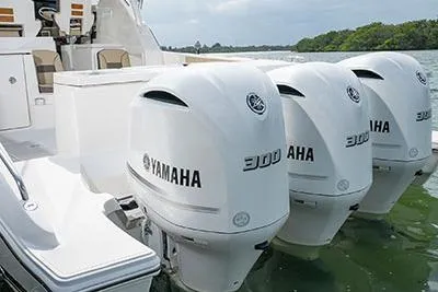 Slide: The Image of 2026 Pursuit OS 355 Offshore boat with triple Yamaha 300 engines on water. - 4