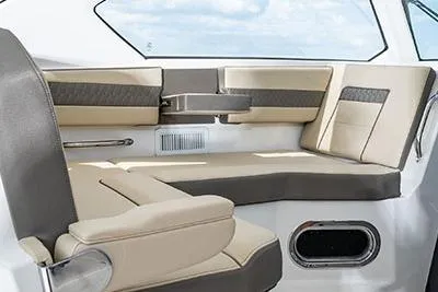 Slide: The Image of 2026 Pursuit OS 355 Offshore boat interior with beige seating and modern design. - 7
