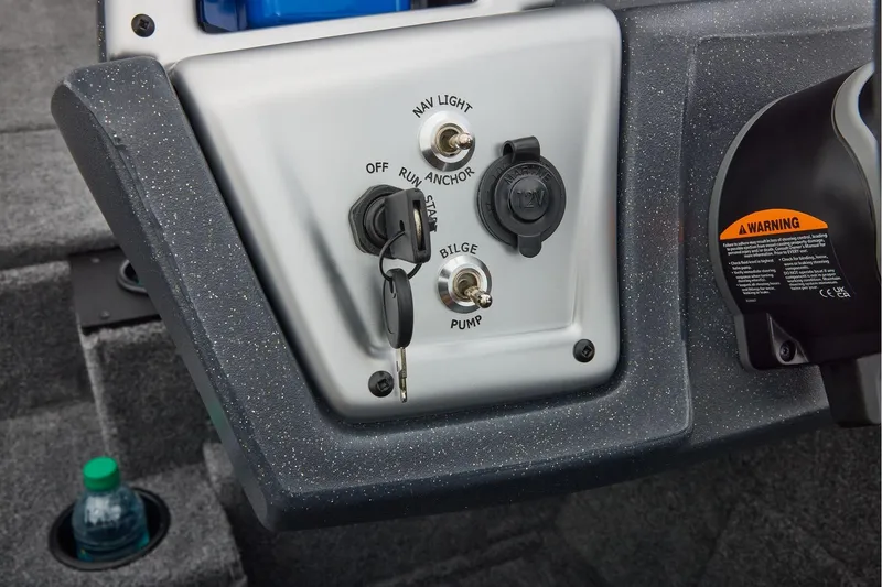 Slide: The Image of Manufacturer Provided Image: Control panel of 2026 Tracker Pro Team 195 boat with ignition and switches. - 41