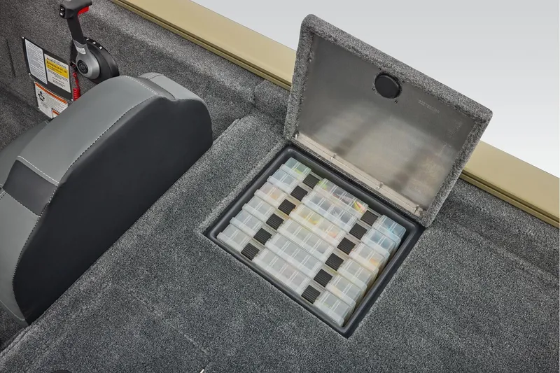 Slide: The Image of Manufacturer Provided Image: 2026 Tracker Pro Team 195 boat storage compartment with organized tackle boxes. - 50