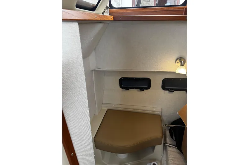 Slide: The Image of 2023 Ranger Tug R-31 CB interior cabin with seating and lighting. - 11