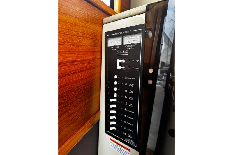 Slide: The Image of Electrical control panel on 2023 Ranger Tug R-31 CB boat. - 13