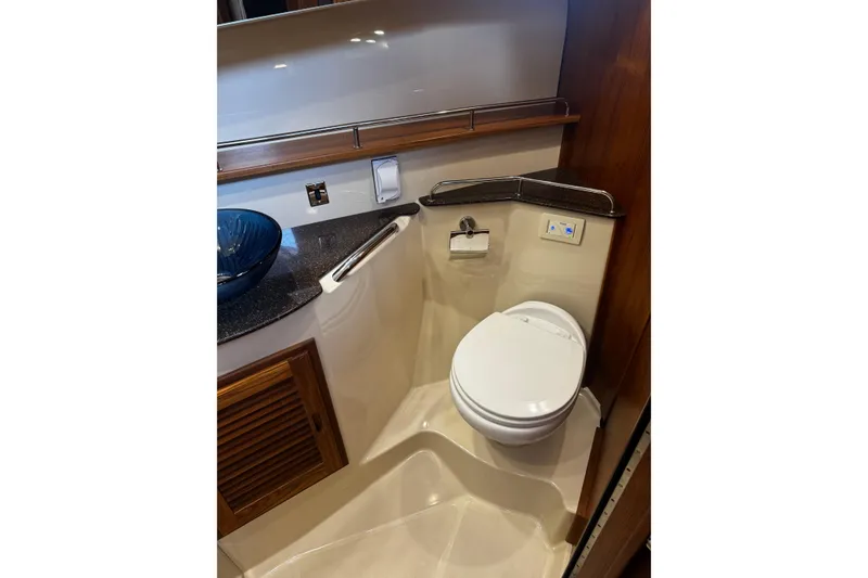 Slide: The Image of 2023 Ranger Tug R-31 CB bathroom with modern fixtures and elegant design. - 17