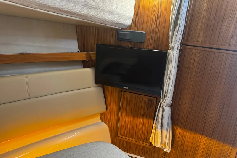 Slide: The Image of Interior of 2023 Ranger Tug R-31 CB with TV and wood paneling. - 22