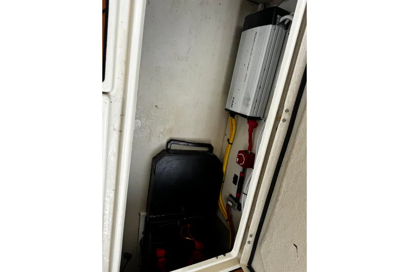 Slide: The Image of Electrical compartment of 2023 Ranger Tug R-31 CB with inverter and wiring. - 7