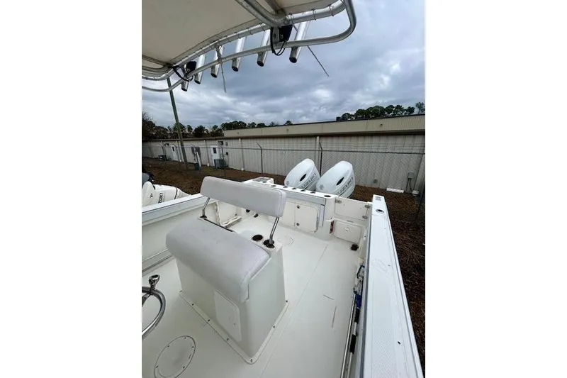 Slide: The Image of 2005 Sailfish 266 CC boat interior with seating and dual outboard motors. - 6