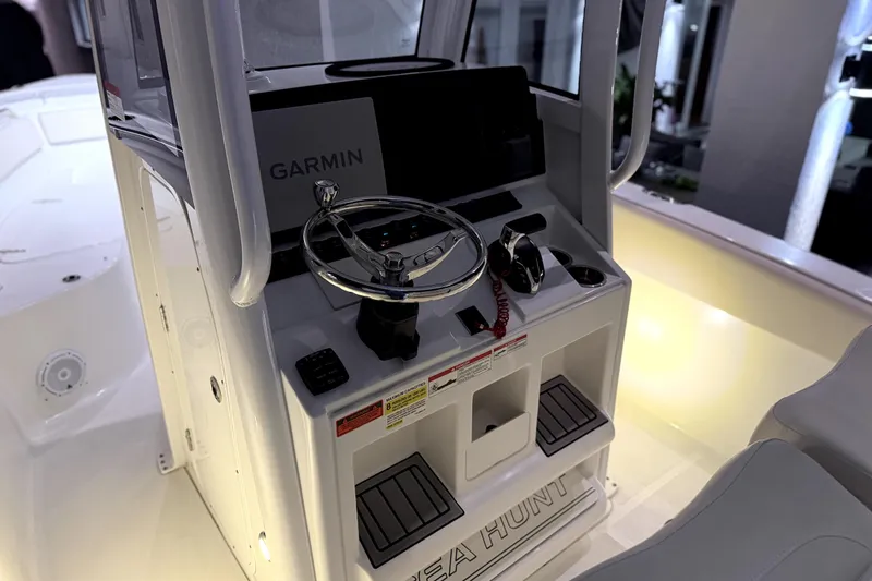 Slide: The Image of 2024 Sea Hunt Ultra 239 SE boat console with Garmin navigation system. - 11