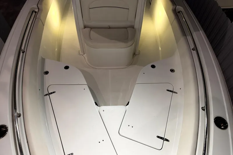 Slide: The Image of 2024 Sea Hunt Ultra 239 SE boat interior with illuminated seating and storage compartments. - 7