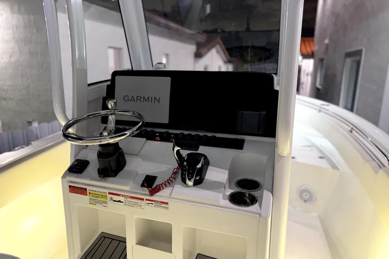 Slide: The Image of 2024 Sea Hunt Ultra 239 SE boat console with Garmin navigation system. - 8