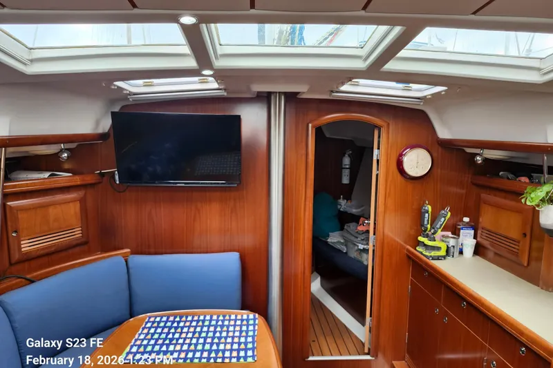 Slide: The Image of Interior of 2005 Beneteau Oceanis Clipper 393 yacht with wood finish and skylights. - 10