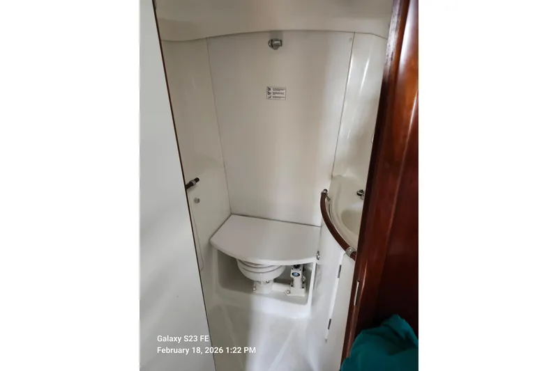 Slide: The Image of Bathroom interior of 2005 Beneteau Oceanis Clipper 393 yacht, featuring compact design. - 12