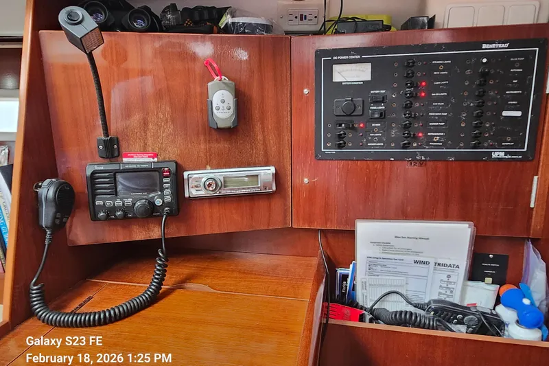 Slide: The Image of Control panel of a 2005 Beneteau Oceanis Clipper 393 sailboat with communication equipment. - 15