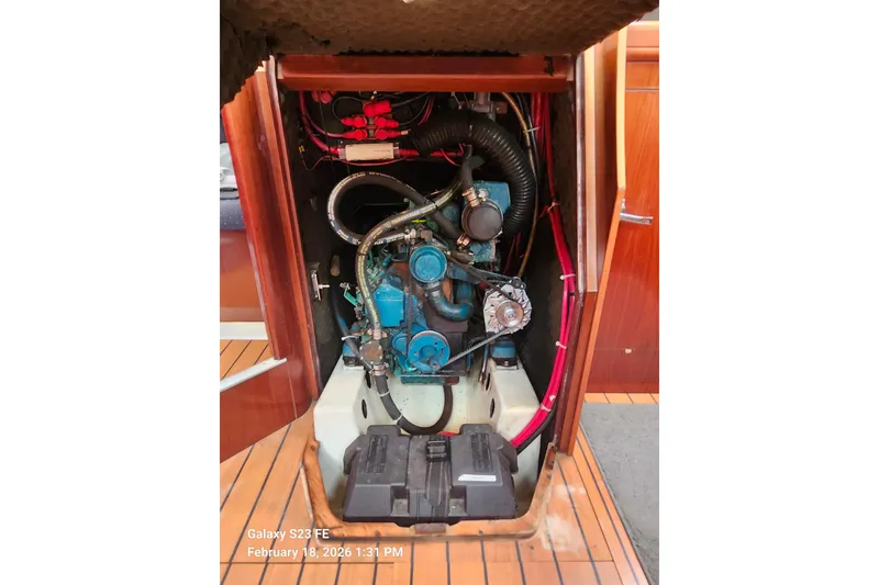 Slide: The Image of Engine compartment of 2005 Beneteau Oceanis Clipper 393 sailboat, showcasing mechanical components. - 19