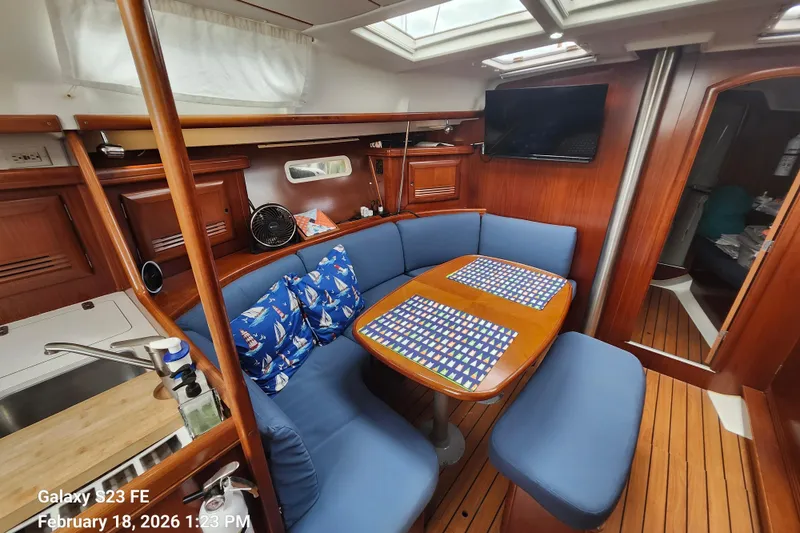 Slide: The Image of Interior of 2005 Beneteau Oceanis Clipper 393 yacht with cozy dining area. - 8