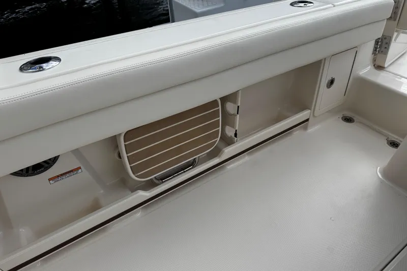 Slide: The Image of Interior view of 2026 Grady-White Freedom 235 boat, showcasing seating and storage features. - 38