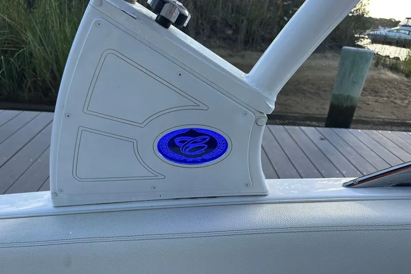 Slide: The Image of 2021 Cobalt R3 boat detail with illuminated logo, dockside view. - 13