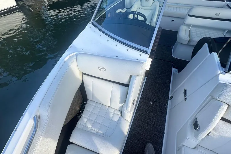 Slide: The Image of 2021 Cobalt R3 boat interior with white seating and sleek design on water. - 21