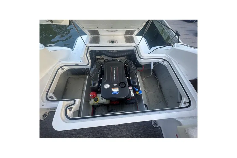 Slide: The Image of Open engine compartment of a 2021 Cobalt R3 boat, featuring a Volvo Penta engine. - 24