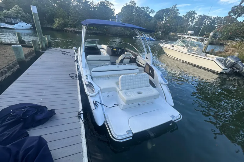 Slide: The Image of 2021 Cobalt R3 boat docked at a marina, featuring a spacious seating area. - 8
