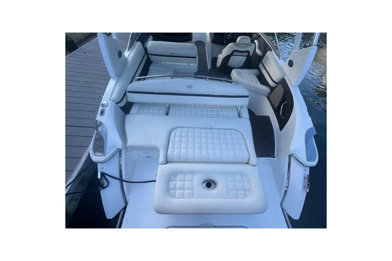 Slide: The Image of 2021 Cobalt R3 boat interior with white cushioned seating and sleek design. - 9