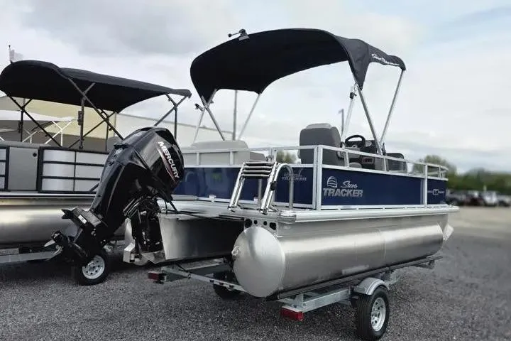 Slide: The Image of 2026 Sun Tracker Bass Buggy 16 XL Select pontoon boat with canopy and Mercury outboard motor. - 12