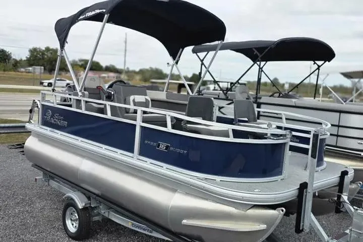 Slide: The Image of 2026 Sun Tracker Bass Buggy 16 XL Select pontoon boat with canopy on trailer. - 14