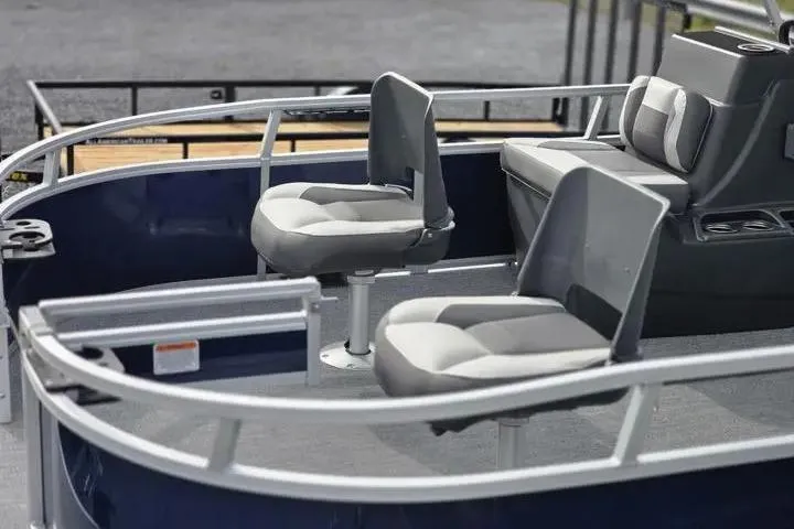 Slide: The Image of 2026 Sun Tracker Bass Buggy 16 XL Select pontoon boat interior with seating. - 2