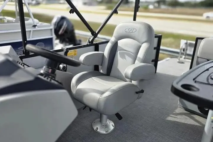 Slide: The Image of 2026 Sun Tracker Bass Buggy 16 XL Select boat interior with plush captain's chair. - 6