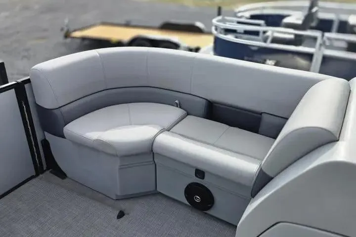 Slide: The Image of 2026 Sun Tracker Bass Buggy 16 XL Select pontoon boat with gray cushioned seating. - 7