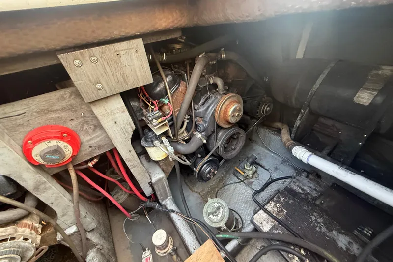 Slide: The Image of Engine compartment of 1986 Chris-Craft 336 Commander boat, showing mechanical components and wiring. - 6