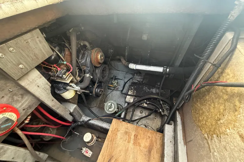 Slide: The Image of Engine compartment of 1986 Chris-Craft 336 Commander with visible wiring and components. - 7