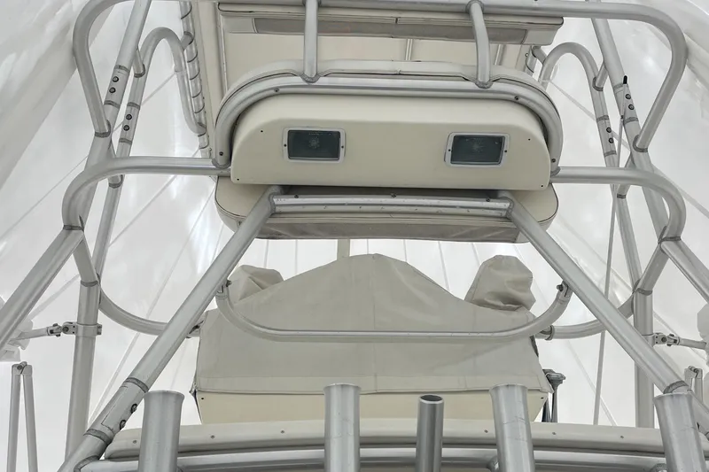 Slide: The Image of 2004 Carolina Classic 28 boat tower with metal framework and covered equipment. - 23