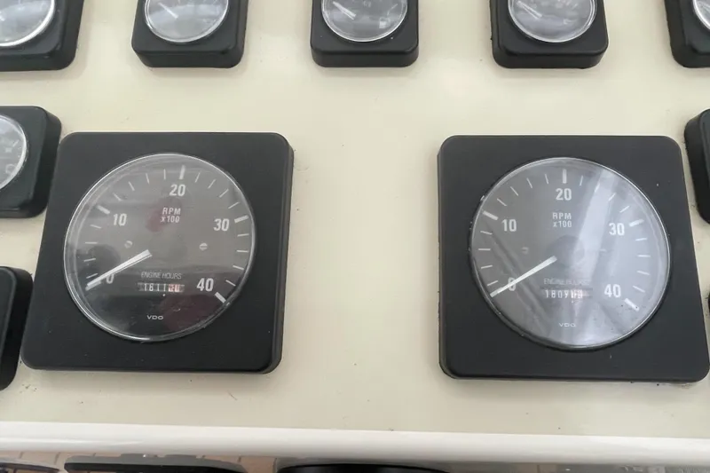 Slide: The Image of Close-up of 2004 Carolina Classic 28 boat tachometers displaying RPM and engine hours. - 31