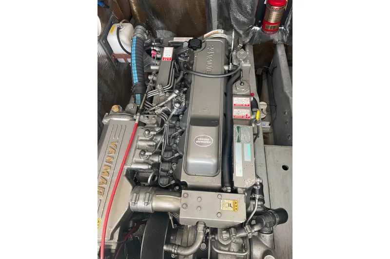 Slide: The Image of Engine of a 2004 Carolina Classic 28 boat, featuring Yanmar diesel components. - 44
