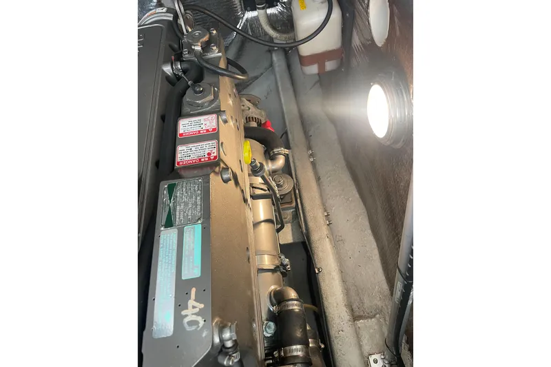 Slide: The Image of Engine compartment of a 2004 Carolina Classic 28 boat, illuminated and detailed. - 47