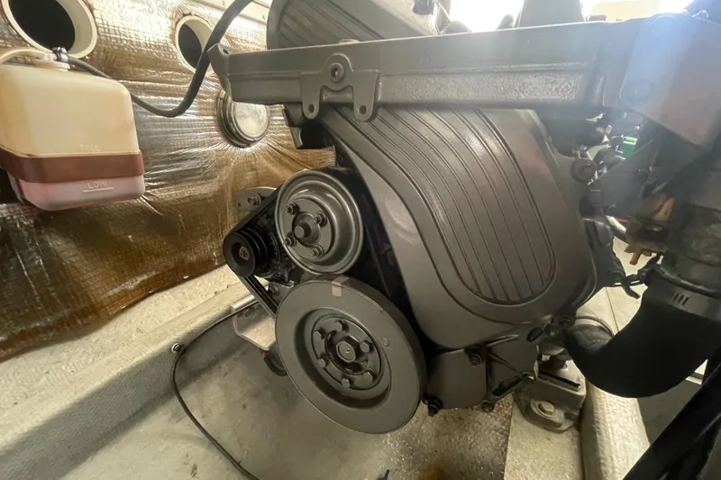 Slide: The Image of Engine compartment of a 2004 Carolina Classic 28 boat, showcasing mechanical components. - 50