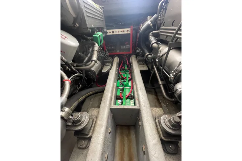 Slide: The Image of Engine compartment of a 2004 Carolina Classic 28 boat, showing wiring and components. - 53