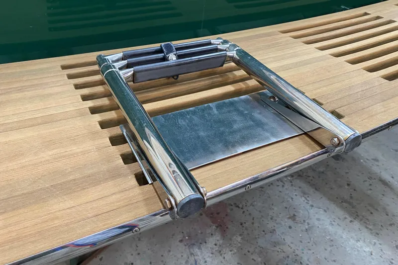 Slide: The Image of Teak swim platform with stainless steel ladder on 1997 Wasque C.W.Hood Wasque 26 boat. - 12