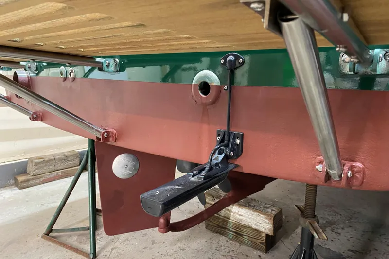 Slide: The Image of 1997 Wasque C.W.Hood Wasque 26 boat underside with rudder and support structures. - 13