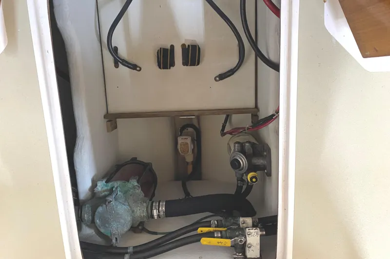 Slide: The Image of Engine compartment of a 1997 Wasque C.W.Hood Wasque 26 boat, showing mechanical components. - 18