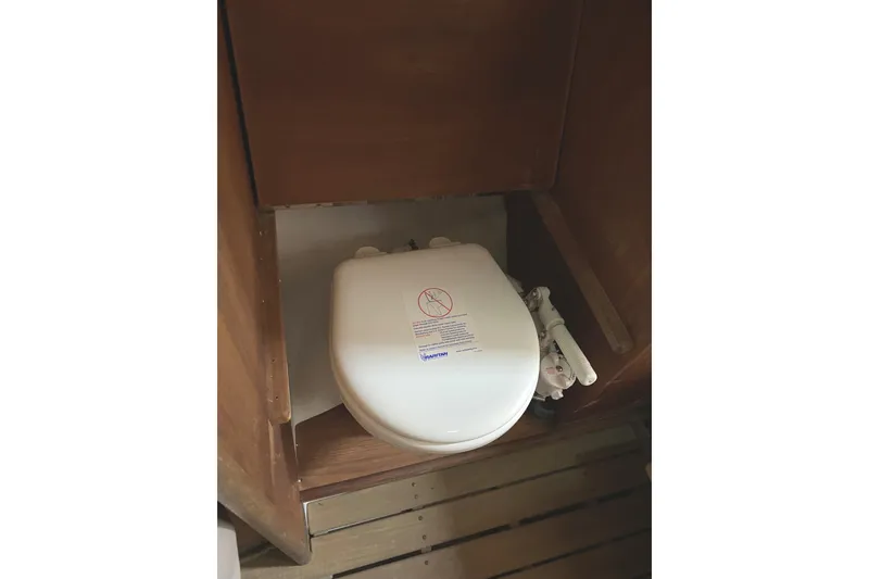 Slide: The Image of 1997 Wasque C.W.Hood Wasque 26 boat toilet in wooden compartment. - 20
