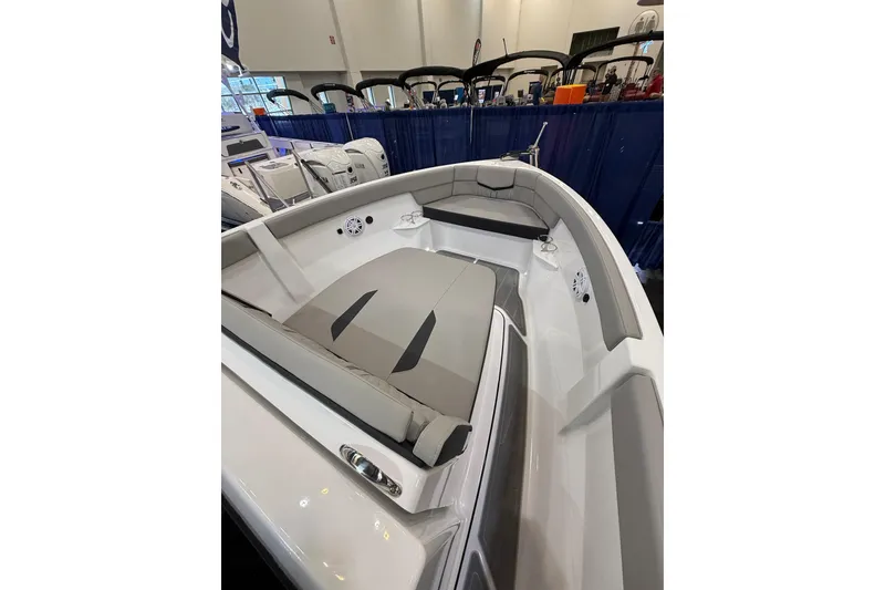 Slide: The Image of 2026 Monterey Elite 25 OB boat interior with sleek seating and modern design. - 13