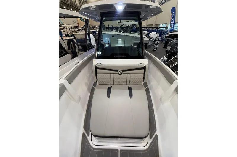 Slide: The Image of 2026 Monterey Elite 25 OB boat interior with sleek seating and modern design. - 14