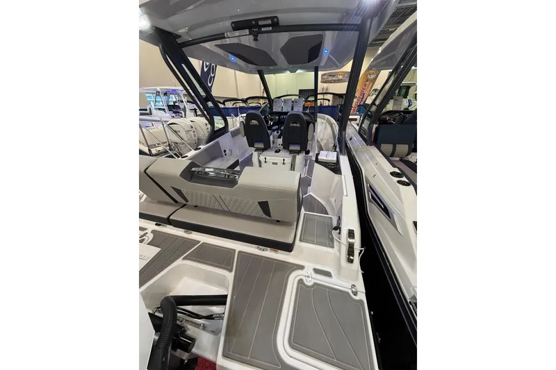 Slide: The Image of 2026 Monterey Elite 25 OB boat interior with modern seating and sleek design. - 5
