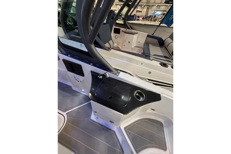 Slide: The Image of 2026 Monterey Elite 25 OB boat interior with sleek seating and modern design features. - 7