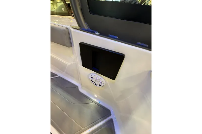 Slide: The Image of 2026 Monterey Elite 25 OB interior with speaker and storage compartment. - 8