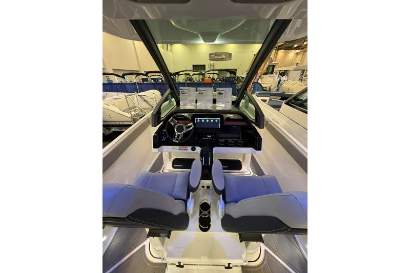 Slide: The Image of 2026 Monterey Elite 25 OB boat interior with modern dashboard and seating. - 9