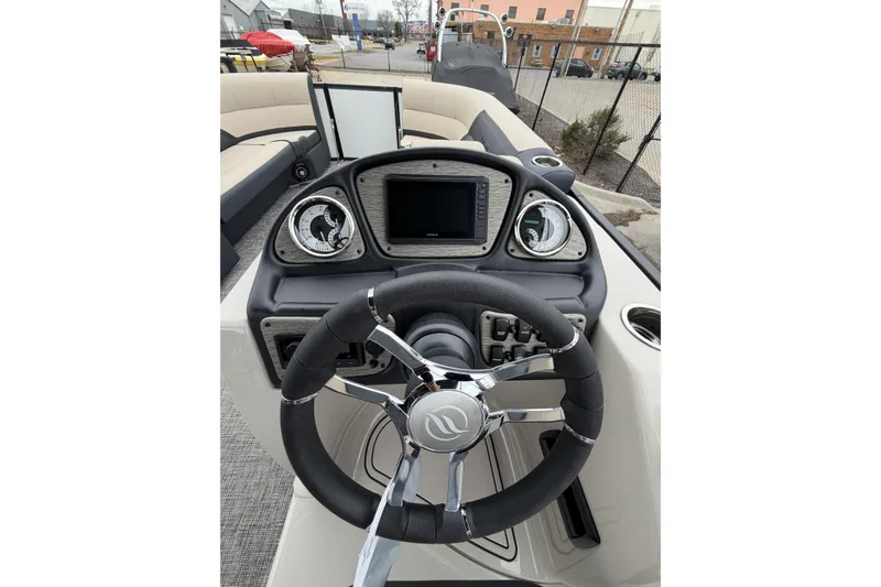 Slide: The Image of Steering console of 2026 Flagship D22RF Ext. Deck boat with modern controls. - 12