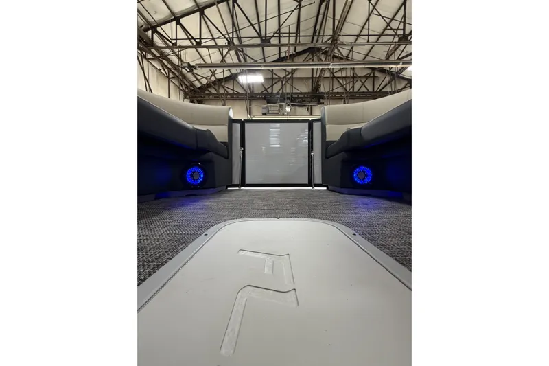 Slide: The Image of Interior view of 2026 Flagship D22RF Ext. Deck with blue LED lights and seating. - 14